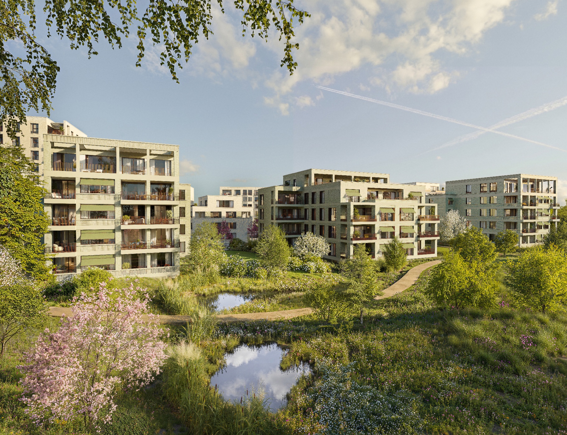 Groene binnentuin met vijvers, bloeiende borders en de residenties van The Wettlands
